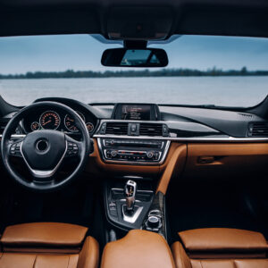 Modern car dashboard and interior with multimedia and leather cozy seats.